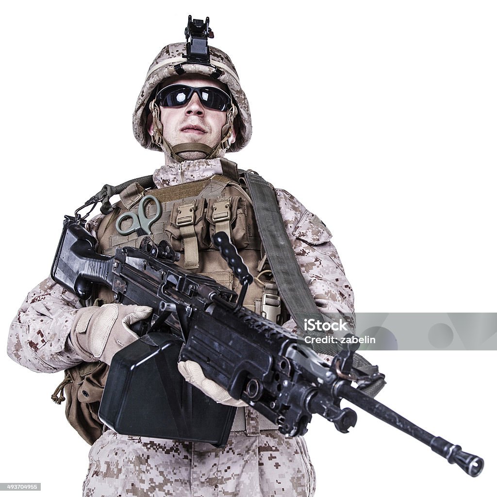 US marine studio shot on white background US marine with his assault rifle on white background Aggression Stock Photo