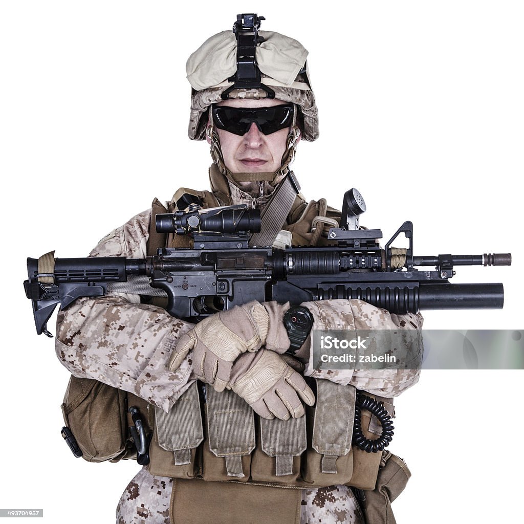 US marine studio shot on white background US marine with his assault rifle on white background Aggression Stock Photo