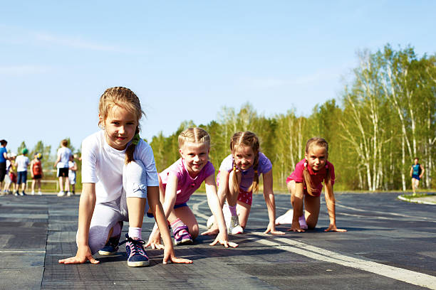 istock girls starting to run on track 493704965