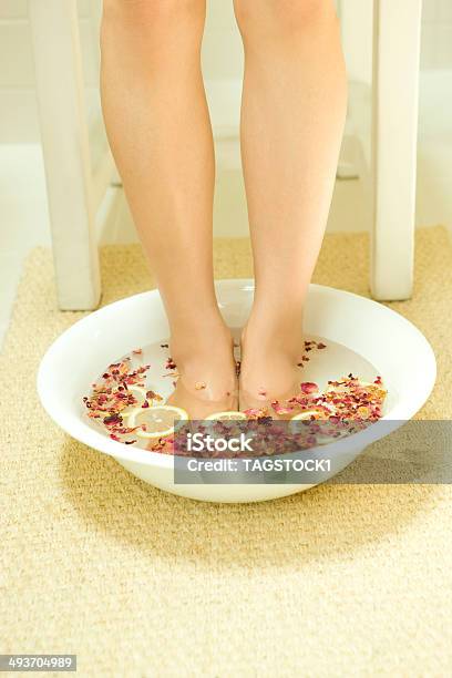 Woman In Footbath Of Rose Red And Lemon Stock Photo - Download Image Now - Foot Bath, Sink, Adult