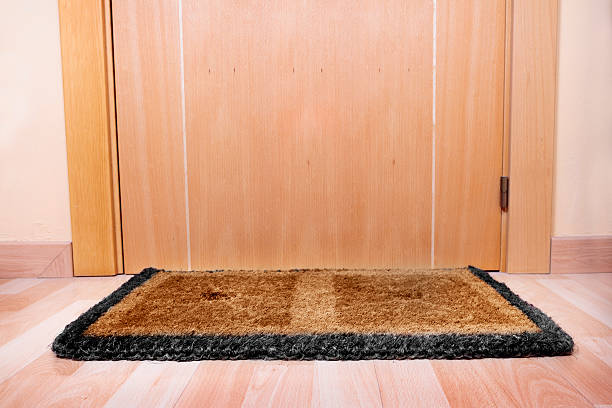 istock Welcome home doormat with open door 493706377