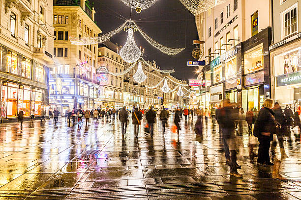famous Graben street by night Vienna, Austria - November 26, 2010: famous Graben street by night in Vienna, Austria. The Graben traces its origin back to the old Roman encampment of Vindobona. people shopping in graben street vienna austria stock pictures, royalty-free photos & images