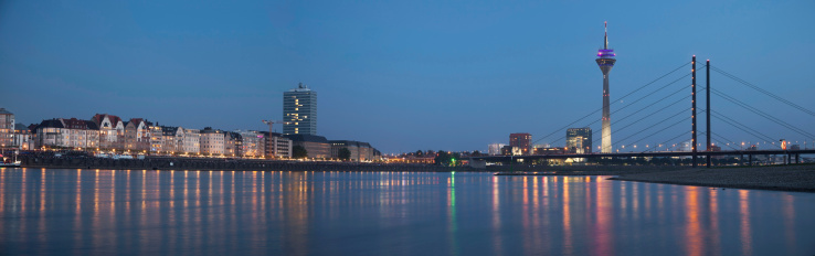 Night panorama of Dusseldorf with Rheinturm tower and Rheinkniebrucke Bridge