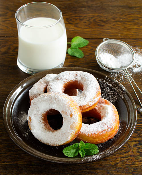 istock With vanilla cream donuts in powdered sugar. 493707069