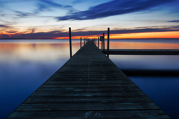 istock Landing stage by the sea at sunset 493707793
