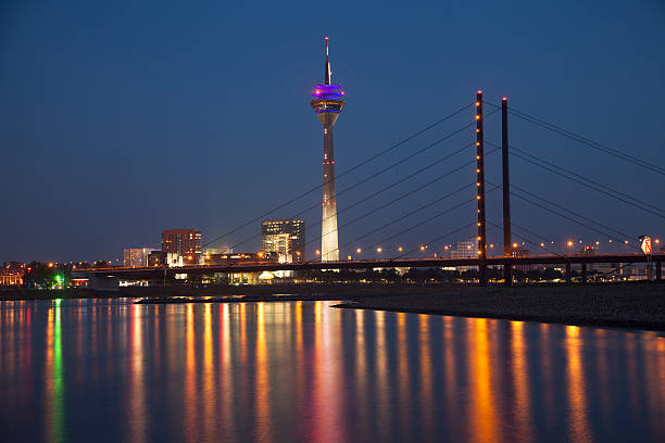 istock Night scene of Dusseldorf with Rheinturm tower 493708255