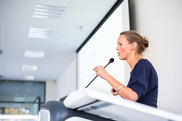 istock Pretty, young business woman giving a presentation 493709237