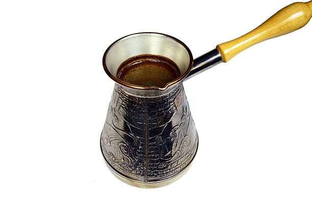 istock turkish coffee brewing pot isolated on white 493710455