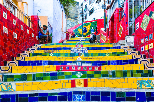 Rio de Janeiro, Brazil - November 30, 2014: Tourists visiting the Selaron stairway in Rio de Janeiro, Brazil. The stairway is famous work of Chilean artist Jorge Selaron.