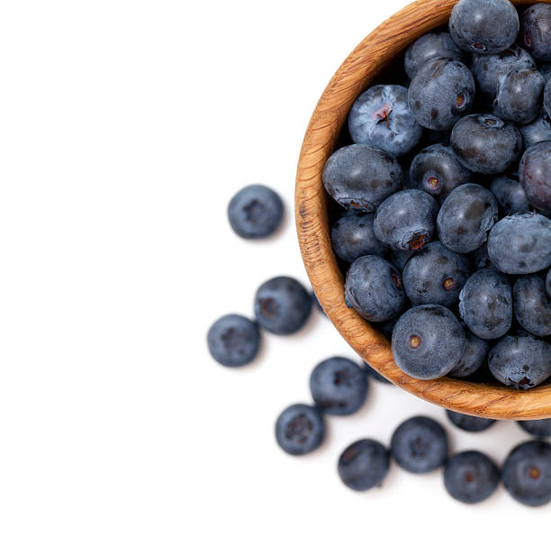 istock blueberries in a wooden bowl 493710812