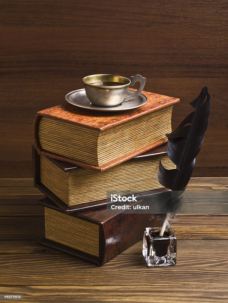 old books and pen on a wooden table Ancient Stock Photo