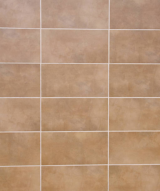 istock Brown ceramic tiles with white fugue on wall 493711240