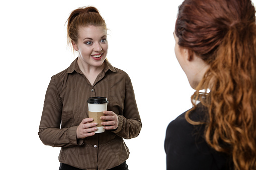 two woman chatting over a cup of coffee