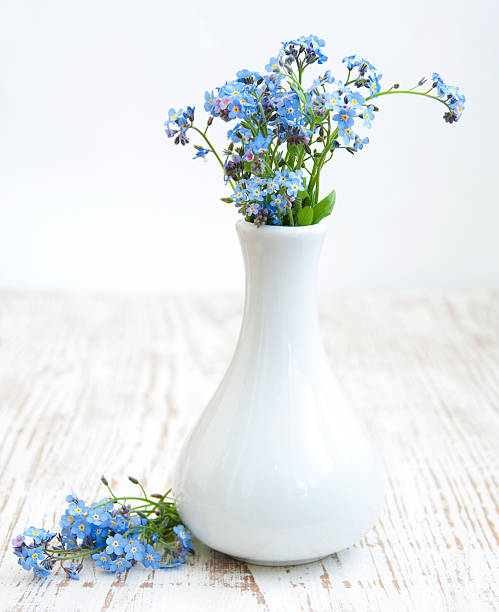 istock forget-me-nots on wooden table 493711703
