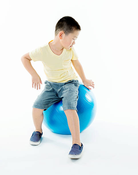 istock Little boy playing with a ball 493712070