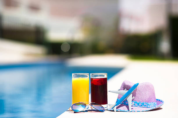 istock Juice, straw hat, sunglasses and airplane model on vacation 493713312