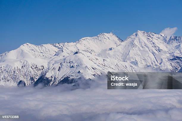 View On Mountains And Blue Sky Above Clouds Krasnaya Polyana Stock Photo - Download Image Now