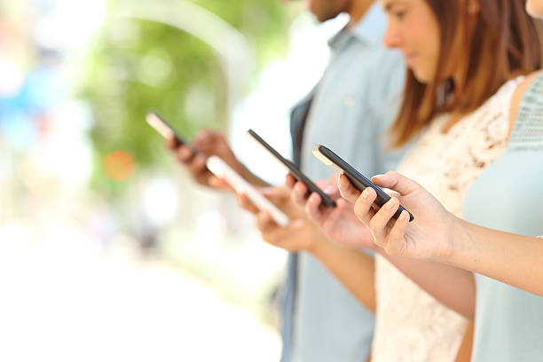 istock Four friends texting in their smart phones 493713988