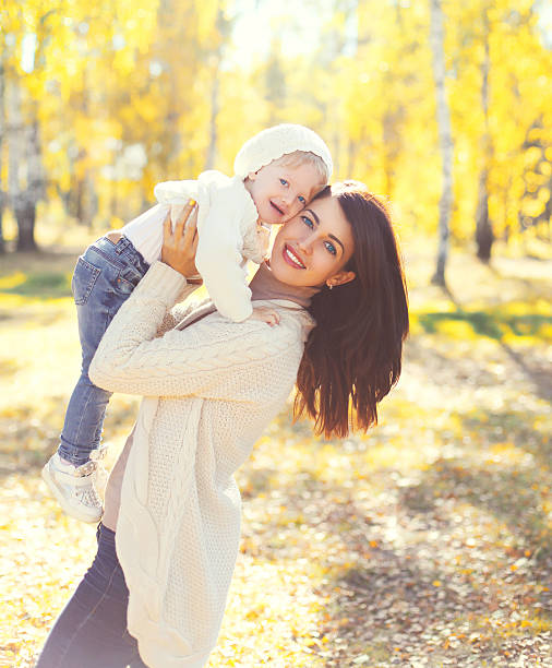istock Happy smiling mother and child playing having fun in autumn 493716548
