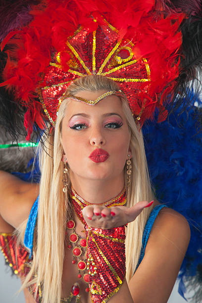 istock Woman samba dancer blowing a kiss towards the camera. 493718800