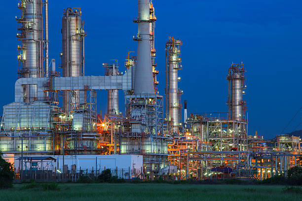 istock oil refinery palnt against dusky blue sky 493719750
