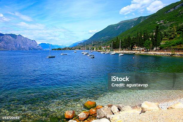 Yacht Ship And Italian Turquoise Translucent Lake Garda Paradise Malcesine Stock Photo - Download Image Now