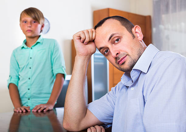 istock Father after argue with teenage son 493720920