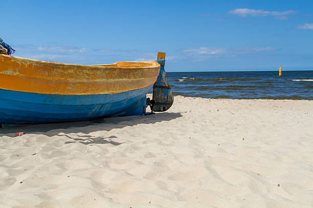istock Baltic sea, fragment of boat on beach 493721476