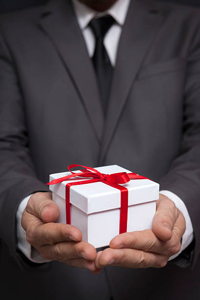 istock Businessman Holding Gift Box 493722556