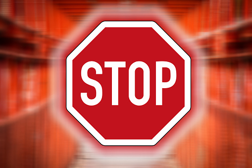 Red Stop sign with red blurred background