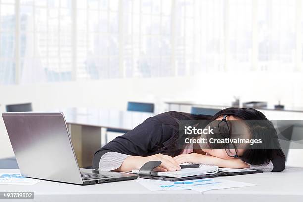 Exhausted Female Entrepreneur Napping In Office Stock Photo - Download Image Now - 2015, Adult, Asian and Indian Ethnicities
