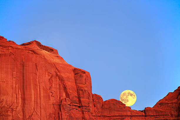 istock Moon Rising Over Rock Formation - Monument Valley, Utah 493740200