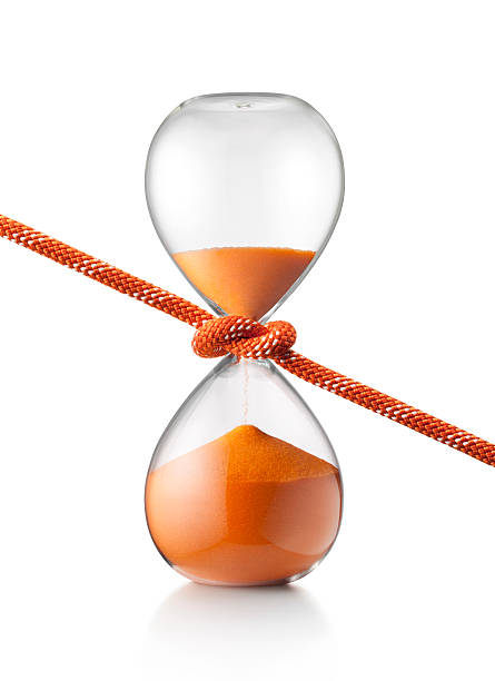 Stop time. Rope tightens an hourglass. High resolution photograph. half past stock pictures, royalty-free photos & images