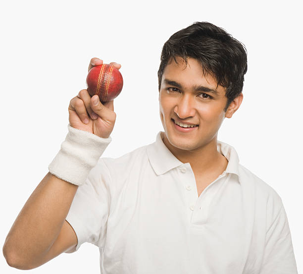 istock Cricket player showing a cricket ball 493741062