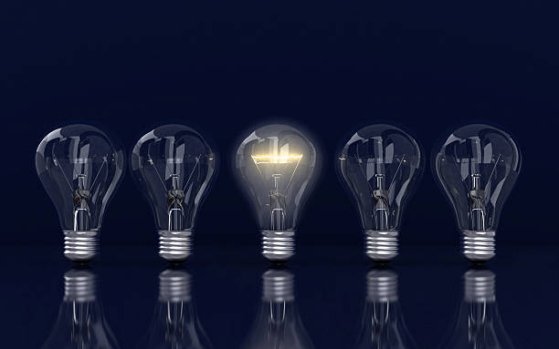 istock Light bulb and row of lamps on a colour background 493742924