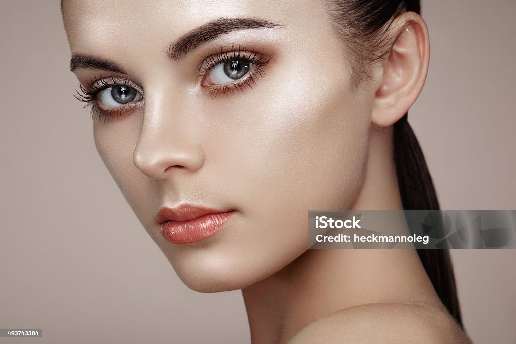 Beautiful woman face Beautiful woman face. Perfect makeup. Beauty fashion. Eyelashes. Cosmetic Eyeshadow. Highlighting Fashion Model Stock Photo