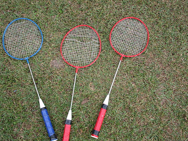 istock BADMINTON RACKETS ON A LAWN 493744194