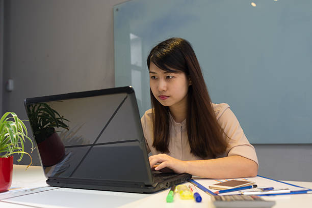istock Manager assistant busy with typing a report for her boss 493744872