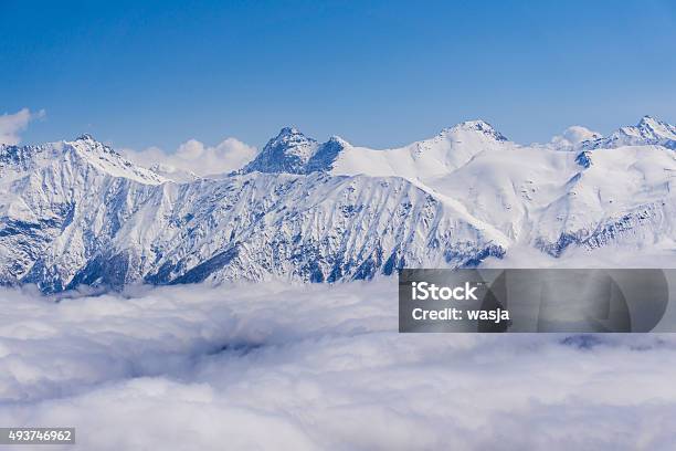 View On Mountains And Blue Sky Above Clouds Krasnaya Polyana Stock Photo - Download Image Now