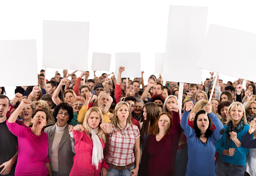 Large group of displeased people standing together. Some of them are holding white banners. Isolated on white. Copy space.