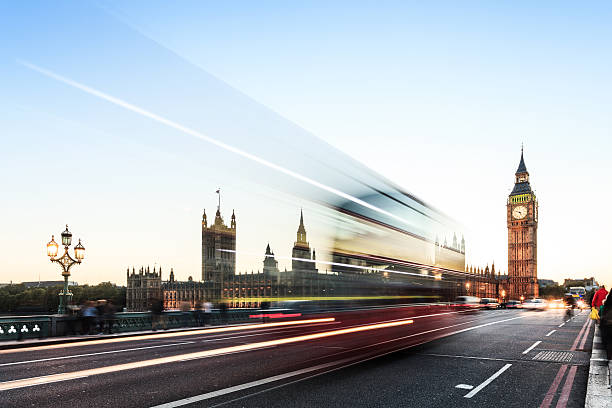 istock London night high contrast - Big Ben with blurred bus 493748596