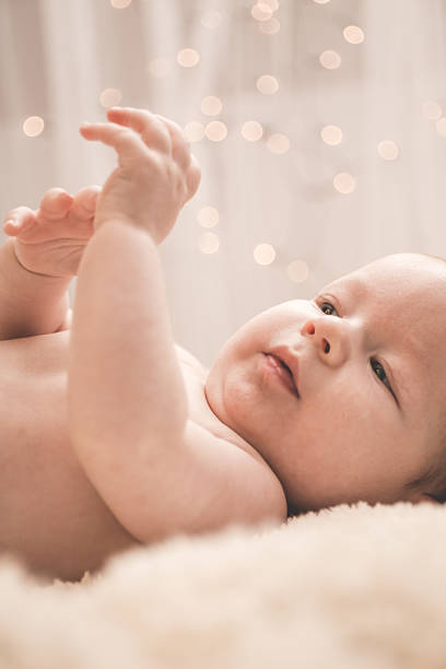 istock Healthy baby watching his hands 493748800