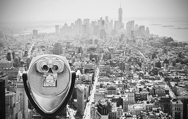 Black and white toned binoculars over Manhattan, NYC. Black and white toned tourist binoculars over Manhattan Skyline, New York City, USA. binoculars photos stock pictures, royalty-free photos & images