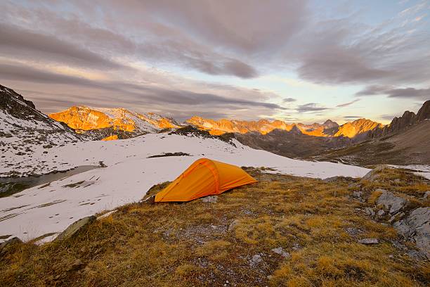 istock Orange tent in the mountains. 493759936