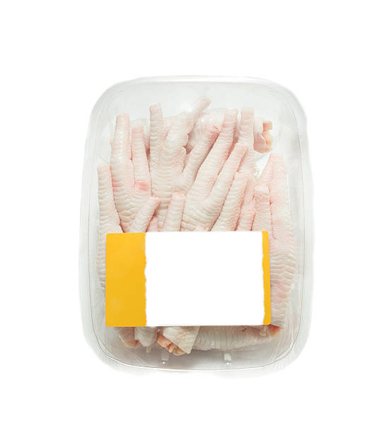 istock chicken feet in packaging  tray with empty price tag 493760174