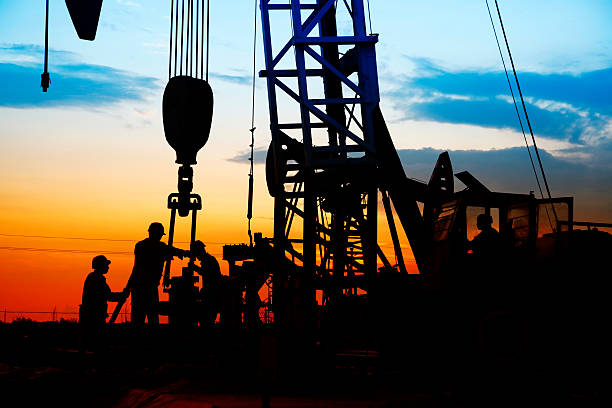 istock oil field, the oil workers are working 493760658