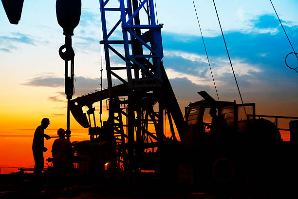 istock oil field, the oil workers are working 493760802