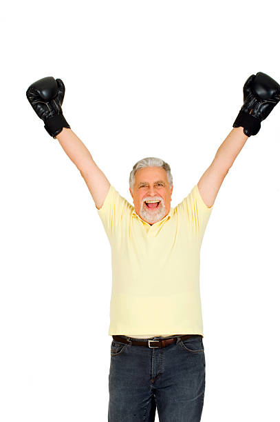 istock elderly man with boxing gloves 493761676