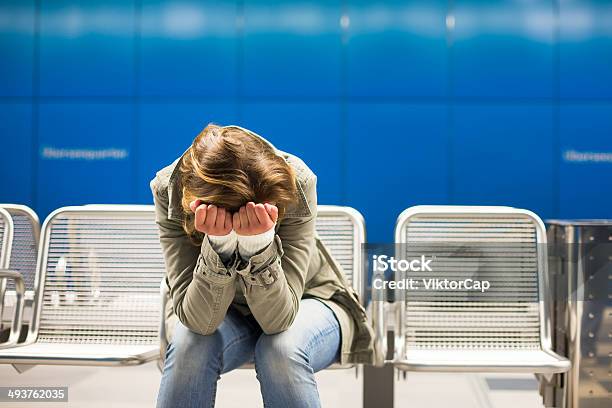 Depressed Young Woman Sitting In A Metro Station Stock Photo - Download Image Now - Abuse, Adult, Adults Only