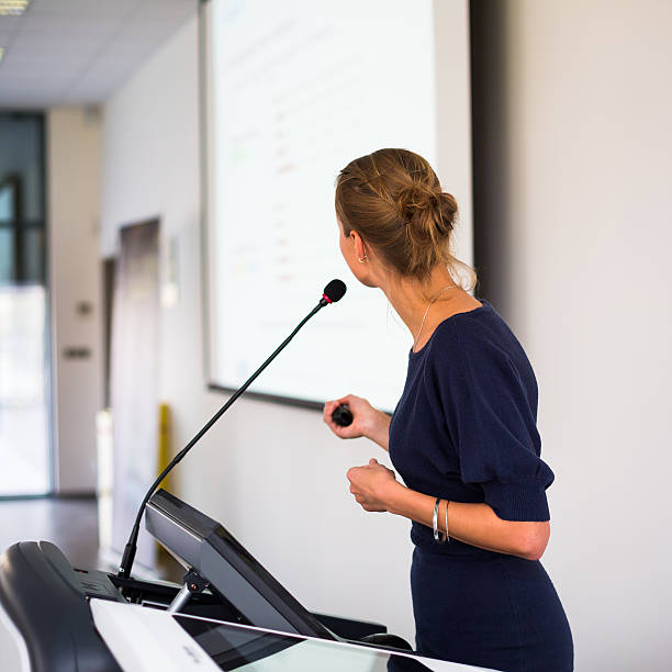 istock Pretty, young business woman giving a presentation 493762985